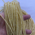 3-4mm round golden pearl strand