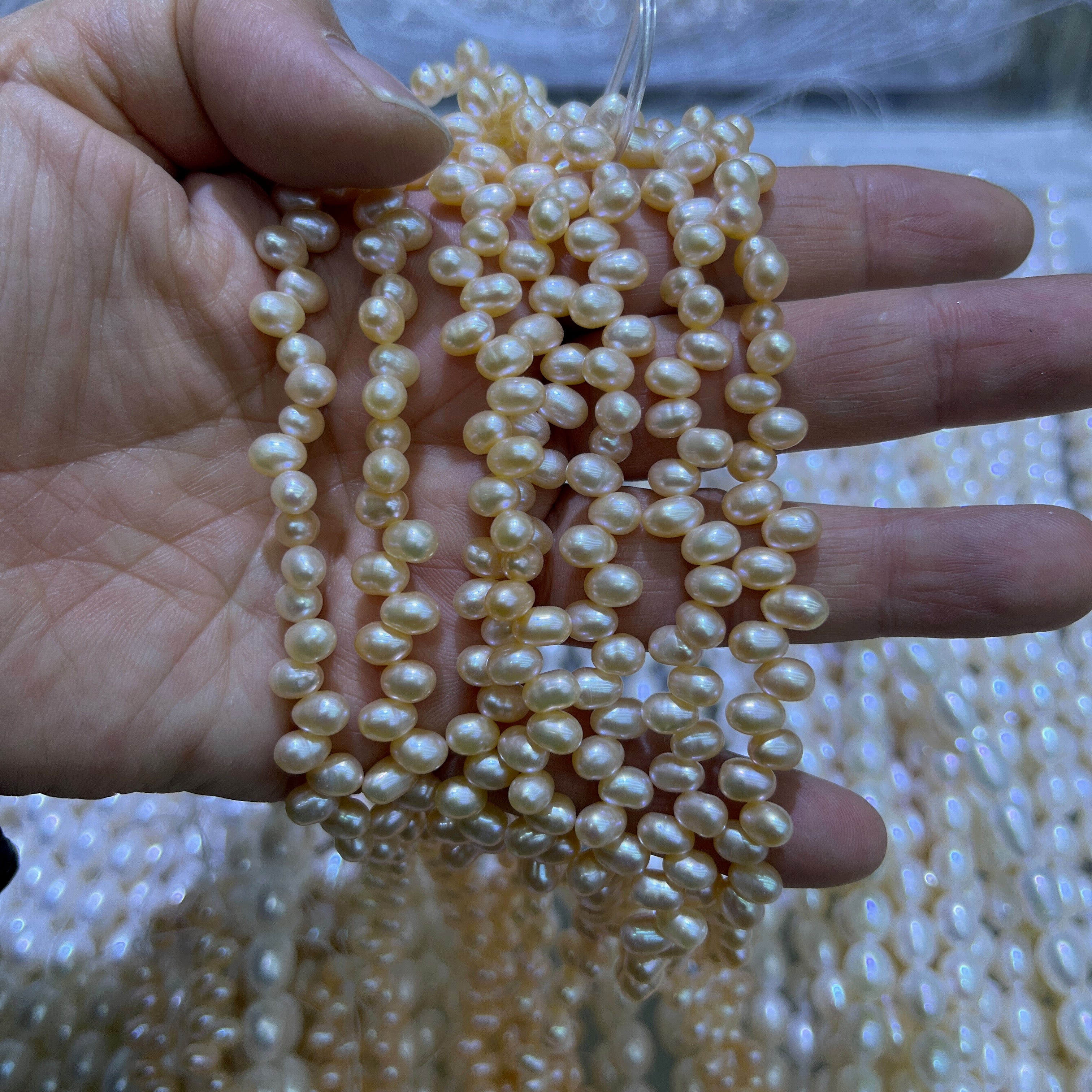 6-7mm oval pearl strand drill on top orange