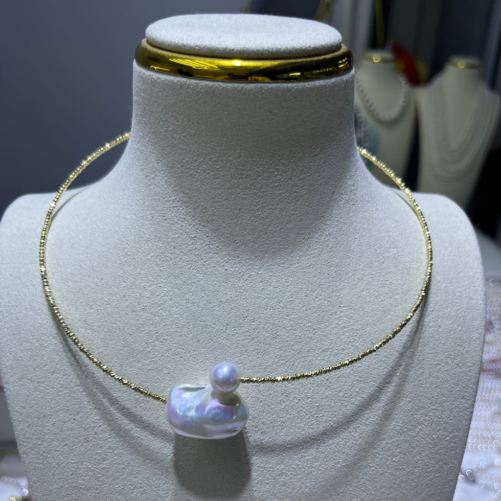 Pearl Necklace with 8mm round pearl and 16mm baroque pearl - A Study in Modern Proportion