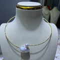 Pearl Necklace with 8mm round pearl and 16mm baroque pearl - A Study in Modern Proportion
